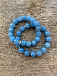 This blue jade bracelet, delicately crafted with gold, exudes an air of elegance and sophistication. Its rich blue hue is known for its calming properties and is believed to bring inner peace and balance to the wearer. A timeless accessory that adds a touch of luxury to any outfit. Peace And Balance, Blue Jade, Jade Bracelet, Timeless Accessories, Blue Bracelet, Blue Hues, Inner Peace, Jade, Bring It On