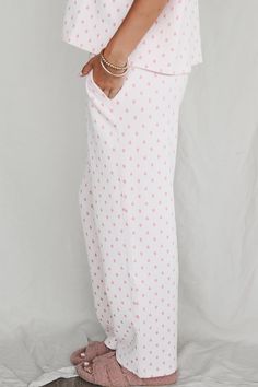 Pink heart pajama pants with elasticated Sunkissed Coconut waistband and side pockets Material is Polyester Tumble dry low Model is 5'6 wearing a small SHOP THE LOOK Small Medium Large X-Large Length 36.5" 37.5" 38.5" 39.5" Waist 13" 14" 15" 16" Sunkissed Coconut, Wedding Guest Romper, Better Everyday, Party Bottoms, Pj Pants, Denim Romper, Shop The Look, Romper Dress, Maxi Dress Party