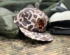 Old School Duck Camo Rope hats featuring the Hat Down Wood Duck Logo on a leather patch.  These hats are from the Lost Hat Co. and feature a snap back closure and a old school vibe. Rope Hats, Louisiana Chicken, Pit Vipers, Dream Proposal, Duck Logo, Country Hats, Patch Hats, Wood Duck, Flat Bill Hats