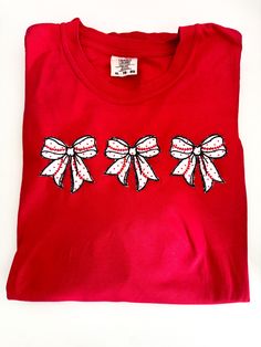 Perfect for you or a gift for teammates, coach or a Team Mom.  Applique embroidered bows with tiny dot red fabric and baseball softball laces.   Whether at the game or hanging out with teammates after practice or during tournaments, this amazing shirt will set you apart!   Affordable and roomy and great for holiday or Christmas gifts, as well as season gifts or matching team travel. This shirt is in XL red, but I can make as many as you want, in whatever colors and sizes you want.  I will update Team Mom Gifts, Travel Ball, Embroidered Bows, Team Mom, Embroidered Baseball, Matching Gifts, Baseball Softball, Red Fabric, Gift Christmas