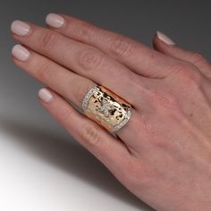 This awesome ring features a hammered finish and is centered with a "X" shaped setting accented with eight (8), bead set, round brilliant cut diamonds. The ring is also accented with twelve (12), bead set, round brilliant cut diamonds. The ring measures 28.7mm at the top, rises 4.8mm above the finger, tapering to 5.0mm wide and 1.0mm thick at the base of the shank. The ring is currently a size 9.5. Wide Band Diamond Ring, Wide Band Diamond Rings, Band Diamond Ring, Bead Set, Wide Bands, Brilliant Diamond, Round Brilliant Cut Diamond, High Quality Jewelry, Brilliant Cut Diamond