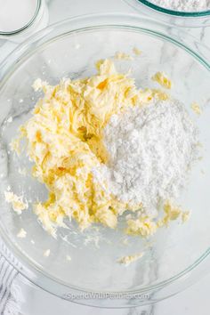 the ingredients are mixed together in a glass bowl on the counter top, including eggs and flour