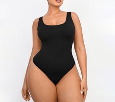 Featuring a low-back design that pairs perfectly with backless dresses, this smoothing bodysuit also features chest support and smoothing at the tummy to provide a lifted and flattering appearance. From Shapellx. Shaping Backless Bodysuit With Built-in Bra, Sleek Second-skin One-piece Bodysuit, Stretch Bodysuit With Moderate Back Coverage, One-piece Second-skin Bodysuit With Built-in Bra, Sleek Solid One-piece Bodysuit, Sleek Solid Color One-piece Bodysuit, Sleek Seamless Shapewear, Second-skin Bodysuit With Built-in Bra And Low Back, Backless Shapewear Leotard With Built-in Bra