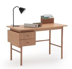 a wooden desk with a lamp on top