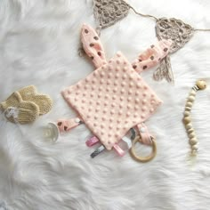 an assortment of accessories laid out on a fur surface