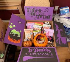 a box filled with halloween treats sitting on top of a table