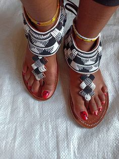 Maasai sandals, gladiators for women ,African beaded gladiators,  women sandals,Summer sandals. This sandals are 100% handmade using maasai beads  All sizes are available as we custom make them.For perfect fitting kindly use the last image as a  guide.Ships via dhl express .Thank you for stopping by. Artisan Adjustable Sandals For Festival, White Beaded Sandals With Round Toe, Traditional Beaded Barefoot Sandals With Single Toe Strap, Bohemian Beaded Sandals For Vacation, White Bohemian Sandals With Single Toe Strap, Bohemian Beaded Toe Ring Sandals For Festivals, Handmade Closed Toe Barefoot Sandals For Festivals, Bohemian Barefoot Sandals For Festival, Traditional Beaded Sandals With Round Toe