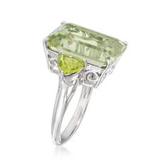 Ross-Simons - 11.00ct Emerald-Cut Prasiolite, 1.40ct t. w. Peridot Ring Size 5. An impressive 11.00 carat emerald-cut prasiolite pops on the finger, enhanced by 1.40 ct. t. w. trillion-cut peridots at each side of the polished sterling silver shank. A lush, verdant cocktail ring for so many fabulous moments. 5/8" wide. Peridot and prasiolite ring. Peridot birthstones are the perfect gift for August birthdays. August Birthdays, Prasiolite Ring, Blue Aquamarine Ring, Huge Rings, Peridot Birthstone, Green Amethyst Ring, Amethyst And Diamond Ring, Turquoise Drop Earrings, London Blue Topaz Ring