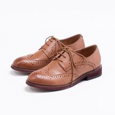 Our Round Toe Casual Leather Flats redefine everyday elegance. With a 2cm heel and lace-up closure, these cow leather flats provide unmatched comfort with sheepskin insoles and pigskin lining, ideal for seamless transitions from casual outings to formal events. Brown Brogue Lace-up Shoes For Office, Spring Low Heel Brogue Oxfords, Spring Low Heel Oxfords With Brogue Detailing, Spring Oxfords With Brogue Detailing And Low Heel, Spring Brogue Oxfords With Low Heel, Leather Wingtip Lace-up Shoes For Fall, Fall Wingtip Lace-up Shoes With Leather Sole, Flat Heel Lace-up Shoes With Textured Sole, Classic Wingtip Lace-up Shoes For Fall