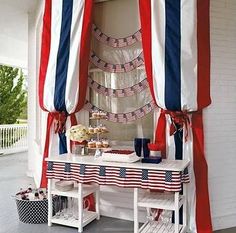 an american flag themed party with red, white and blue decorations on the outside wall