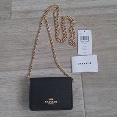 Brand New With Tag, Never Used. Coach Mini Wallet On Chain. Coated Canvas With Shiny Gold Tone Hardware. The Color Is Black. Button Snap Closure. Removable Chain Strap. A Couple Of Card Slots On The Inside. Wear As A Micro Bag Or Remove The Chain As Use As A Wallet/Card Holder. Perfect For Everyday Use. Durable, Practical And Versatile. Timeless And Classic. Adorable And So Fun To Wear. Coach Mini Wallet On A Chain, Coach Wallet On Chain, Heel Outfits, Coach Mini Wallet, Dior Mini Bag, Coach Sling, Micro Bag, Handbag Essentials, Everyday Purse