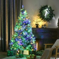 a brightly lit christmas tree in a living room