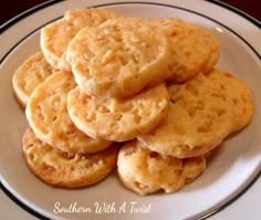 some cookies are on a white plate with black trim