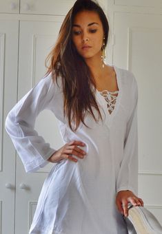 "'White Morrocan Tunic Dress - Karima's style-\" This is a vintage Moroccan Tunic dress ideal for any casual wear. Made in the traditional Moroccan tunic style, this tunic has some fabulous embroidery work. I hope you can enjoy them and be able to touch the moroccan art in your fashion. This tunic could be comfortably worn with any Jacket /Cardigan, and would look FAB with high heels,or leather boots. Could be worn with belts too Sizes: One Size (fits S-L size) Bust: 105 cm, Length: 35\" (87cm) Free Size Long Sleeve Beach Dress For Summer, White Hippie Beach Dress For Beach Party, Long Sleeve Boho Dress For Beach, Hippie Long Sleeve Vacation Dresses, White Tunic Dress For Beach Party, Free Size Long Sleeve Beach Dress, Long Sleeve Free Size Beach Dress, Loose Fit Long Sleeve Beach Dress For Beach Season, Long Sleeve Boho Dress For Summer Beach