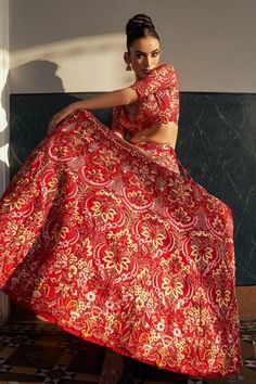 Red attached cancan lehenga with all over carnation floral, sequin embroidery. Paired with a padded blouse with floral carnation embroidery and dupatta with similar work. - Aza Fashions Red Semi-stitched Lehenga With Motifs, Red Lehenga With Motifs For Navratri, Red Festive Lehenga With Motifs, Red Choli With Motifs For Wedding, Festive Red Lehenga With Motifs, Red Dresses With Motifs For Reception, Red Bollywood Lehenga With Motifs, Red Wedding Dresses With Motifs, Red Motifs Anarkali Set For Wedding