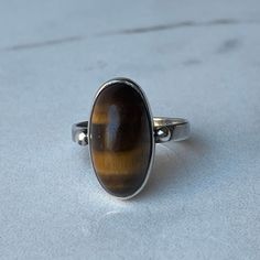 CORY Vintage Sterling Silver Tiger's Eye Ring Size 8 Beautiful ring marked "CORY Sterling". Weight: 5.0 grams.  In excellent vintage condition! Tigers Eye Ring, Eye Ring, Tigers Eye, Tiger's Eye, Beautiful Ring, Tiger Eye, Rings Statement, Vintage Sterling Silver, Tigers