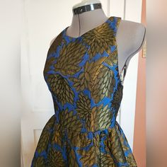 Fun Color In This Flirty Olive And Blue Quilted T Back Brocade Mini Dress By Ark & Co. Fabric Has Gorgeous Sheen And Weight Which Gives The Circle Mini Skirt Volume. T Top With Zip Back And Interesting Side And Back Cutouts. Bust 34. Waist 25. Hip Free. Nwt. Size Small. Royal Blue A-line Mini Dress For Party, Blue Fit And Flare Midi Dress For Evening, Blue Fit And Flare Party Mini Dress, Blue A-line Mini Dress For Party, Evening Fit And Flare Blue Dress, Evening Blue Fit And Flare Dress, Royal Blue Sleeveless Mini Dress For Cocktail, Royal Blue Sleeveless Cocktail Mini Dress, Blue Festive Dress For Party Season