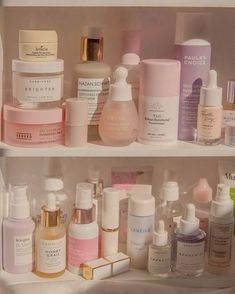 a shelf filled with lots of different types of skin care products on top of each other