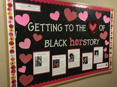 a black history bulletin board with pink and red hearts on it, surrounded by flowers