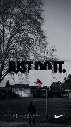 a man standing in front of a basketball hoop with the words just me on it