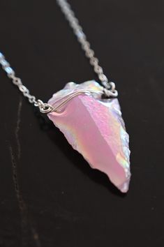 This Aura Rose Quartz Arrowhead Necklace is the most perfect poppy, electric pink! She glows in the light and has a warm energy to her. If you're a pink lover, this necklace is for you. Aura Rose Quartz is a high-energy, happy stone! Aura Rose Quartz arrowhead pendant Sterling silver cable or sterling silver satellite chain, refer to the listing image Pendant length approximately 1 3/8" Handmade in Arizona Please use the size guide below to confirm your length. Contact us if you would like a len Silver Unique Jewelry, Pink Spiritual Crystal Necklaces, Pink Necklace With Adjustable Chain As A Gift, Pink Rose Quartz Wire-wrapped Necklace, Pink Wire Wrapped Necklace, Pink Rose Quartz Wire Wrapped Necklace, Pink Crystal Necklaces With Adjustable Chain As A Gift, Pink Rose Quartz Crystal Necklace Gift, Pink Crystal Necklaces With Adjustable Chain For Gift