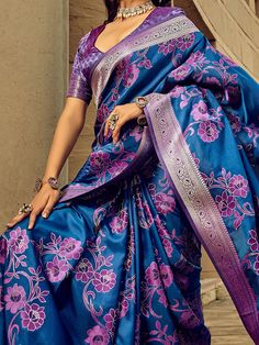 This beautiful ensemble features a beautiful blue-color silk saree with intricate threadwork and zari weaving, adding a touch of elegance and sophistication to your look. The saree comes with a purple silk blouse that also showcases exquisite zari weaving work, making it a perfect match for the saree.
The 5.50-meter saree and unstitched blouse material offer you the freedom to customize the fit according to your preference. The silk fabric ensures a comfortable drape, allowing you to move with e Semi-stitched Royal Blue Saree, Royal Blue Art Silk Saree For Eid, Blue Banarasi Silk Blouse Piece For Eid, Blue Banarasi Silk Blouse For Eid, Blue Katan Silk Blouse Piece, Royal Blue Art Silk Saree, Blue Banarasi Silk Saree With Unstitched Blouse, Purple Katan Silk Blouse Piece For Eid, Blue Banarasi Silk Blouse For Transitional Season