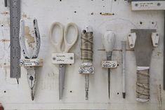 there are many different types of scissors on the wall