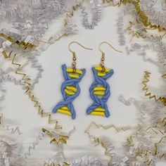 Handmade clay earrings designed to look like DNA, as inspired by the BTS song of the same name.  DNA was released on September 18, 2017 as part of the Love Yourself: Her album. The song explores the theme of love and destiny, saying that DNA connects us together.  Based on this record breaking song, these earrings are handcrafted with clay to create a DNA design. Inspired by the colors of DNA music video, these blue and yellow DNA earrings are perfect to showcase your connection to BTS.  Each earring is handmade with love and care, so just like each ARMY has a different DNA, each earring might have slight variations. Dna Music, Love And Destiny, Dna Earrings, Dna Design, Clay Dangle Earrings, Handmade Clay Earrings, Cambridge Ma, Handmade Clay, Etsy Earrings Dangle