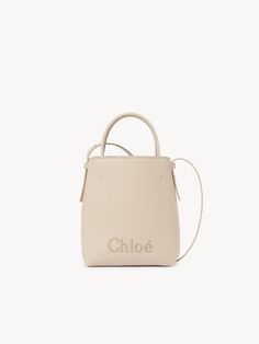 Chloé Chloé Sense Micro Tote Bag | Chloé US Minimalist Daily Bag With Detachable Handle, Everyday Shoulder Bag With Handle Drop, Daily Top Handle Shoulder Bag With Handles, Chic Everyday Top Handle Bucket Bag, Chloe Logo, White Tote, Bag Collection, Chloe Bag, Overnight Bag