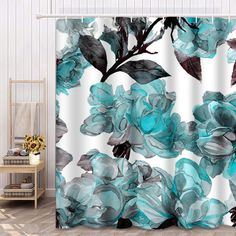 a shower curtain with blue flowers on it