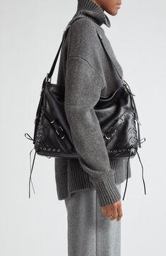 Grommets strung with corset-inspired lacing reflect Matthew Williams's hardware-heavy aesthetic on this leather hobo bag crafted in a slouchy silhouette. Top zip closure Adjustable shoulder strap Interior zip pocket Leather Made in Italy Designer Handbags Hobo Bag Aesthetic, Heavy Aesthetic, Slouchy Hobo Bag, Matthew Williams, Dream Bags, Fall Lookbook, Bags Aesthetic, Leather Hobo Bag, Leather Hobo