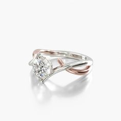 a white and pink gold ring with a diamond in the center on a white background