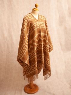 WE SHIP VIA DHL EXPRESS, ESTIMATED DELIVERY TIME IS APPROXIMATELY 5 TO 7 DAYS. PLEASE SEND US BY ETSY MESSAGE YOUR CELL PHONE NUMBER AND YOUR UPDATED EMAIL ADDRESS. This unique and beautiful poncho is made by Peruvian artisans with alpaca wool, a very fine and soft wool, one of the most sought after for its incredible qualities such as elasticity and resistance. This poncho is perfect for the winter and autumn seasons because its fiber is highly warm. It has an Andean tribal design, and its colo Traditional Fringe Poncho One Size, Traditional One Size Woven Poncho, Traditional Woven Shawl Poncho, Traditional Fringed Poncho Shawl, Traditional Woven Shawl For Fall, Traditional Fringe Poncho For Fall, Traditional Fall Poncho With Fringe, Beige Alpaca Shawl Poncho, Traditional Shawl Poncho One Size