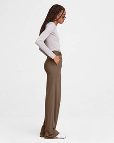 An ultra-modern reimagining of officewear, remixed with home-officewear-level comfort. The Studio Jersey Pant is a wide leg, pull-on knit rib pant crafted from our unbelievably soft signature jersey. rag & bone Women's Slim Fit Pants | Warm Taupe, Large (also in XXS,XS,S,M) Versatile Wide Leg Elastane Pants For Loungewear, Chic Ribbed Wide Leg Full Length Pants, Chic Full-length Ribbed Wide Leg Pants, Chic Stretch Modal Bottoms, Chic Ribbed Straight Leg Wide Pants, Ribbed Workwear Pants, Chic Ribbed Wide Leg Pants, Stretch Ribbed Pants For Work, Ribbed Wide-leg Workwear Pants