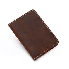 Start an international adventure with our new Priam Handmade Leather Passport Cover. The cover is made using full-grain crazy horse leather. This distressed leather is beautiful and will develop an amazing patina over time. The Priam Handmade Leather Passport Cover is a great way to protect your passport. It has been designed with the help of our professional designers in order to provide you with an elegant yet practical solution for your travel documents. The design features two compartments t Minimalist Leather Travel Backpack, Modern Leather Backpack For Daily Use, Minimalist Leather Travel Wallet, Minimalist Rectangular Leather Backpack, Leather Bags With Card Slots For Travel, Leather Bifold Bags With Interior Card Slots, Versatile Brown Leather Wallets, Leather Travel Wallets Rectangular Shape, Rectangular Leather Travel Wallets