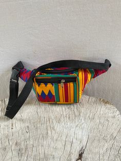 African Print fanny pack/Waist bag in bright, bold prints Perfect for storing all the little things you need when out doing errands, enjoying days out and all the fun stuff you like to do Adjustable straps Zipper closure Handmade