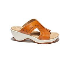 Meet your new go-to slide for any occasion: the Cassandra wedge sandal! The rich leather upper and hook-and-loop closure means you can add style to your everyday look while stepping in complete comfort. From Halsa. Summer Leather Mules With Ortholite Insole, Leather Mules With Ortholite Insole For Summer, Beach Mules With Arch Support, Leather Slides With Arch Support And Wedge Heel, Casual Toe Loop Wedge Sandals For Spring, Comfortable Slide Wedge Sandals With Removable Insole, Comfortable Wedge Sandals With Ortholite Insole, Leather Toe Loop Wedge Sandals, Casual Leather Wedge Sandals With Toe Loop