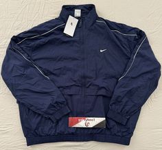 Nike Sportwear Solo Swoosh Woven Track Jacket FB8622-410 Size: Mens Size Large Color: Thunder Blue New with tags. 100% Authentic Nike Product! Any question feel free to contact us. *****IMPORTANT***** ***No returns accepted*** Return Policy. Due to high cost of shipping, WE DO NOT take any RETURNS DUE TO SIZE FITTING, and COLOR ISSUE. ***Items 100% Authentic.*** We guarantee all of our items are authentic. Items on the photos and description is the one you’re getting guarantee. ***International Nike Navy Sports Outerwear, Navy Sportswear Outerwear With Pockets, Nike Long Sleeve Navy Track Jacket, Nike 2000s, Old Nike, 2000s Men, Nike Tracksuit, Nike Vintage, Tracksuit Jacket