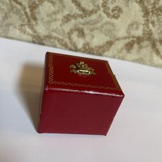 a red box sitting on top of a white table