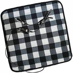 a black and white checkered blanket with two cords attached to the back of it