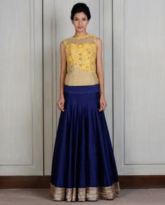 Corset of this lehenga is made in beige raw silk panelled with yellow resham and sequin embroidery on the front and sheer net back having side Zip Skirt: Blue raw silk skirt with hand-sewn sequins embroidered border and drawstring waist. Dupatta: Beige net dupatta with velvet golus. Can be customised in any color and with heavy dupatta Corset Lehenga, Mehndi Outfit, Curated Outfit, Blue Corset, Lehenga Choli Online, Embroidered Border, Sequin Embroidery, Indian Inspired, Net Dupatta