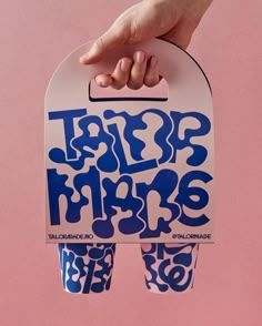 a person holding up a skateboard with the words trap hope on it's side