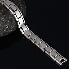 Bold and unique, this bracelet makes an adorable gift for people who are looking for a men's bracelet. Crafted in titanium steel, the bracelet shows a unique and pristine look. Just take this handsome design. It won't disappoint you! Material: Titanium SteelPlating Color: Silver, Yellow Gold Modern Stainless Steel Rectangular Chain Bracelet, Modern Stainless Steel Chain Bracelet, Modern Durable Silver Bracelets, Modern Stainless Steel Durable Chain Bracelet, Modern Stainless Steel Chain Bracelet With Polished Finish, Modern Magnetic Jewelry For Gifts, Formal Rectangular Stainless Steel Bracelet, Modern Silver Tungsten Carbide Jewelry, Rectangular Stainless Steel Bracelet For Formal Events