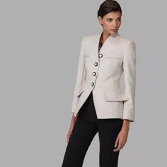 Elegant Fall Jacket From The Armani Black Label Collection. It Was Made In Italy Of A Very Soft Wool/Angora Blend In A Cream Color. The Jacket Has Contrasting Buttons...Please Note The Top Button Does Not Have A Button Hole (Intentionally). New With Tags And Retail Of $4495. Please Note The Armani Logo Chain On The Inner Collar Has Come Partially Loose. The Jacket Is An Italian 38 And Measures 15.5" Across The Shoulders, 16" Across The Bust And Is 25" In Total Length. Tailored Chic Blazer With Stand Collar, Elegant Structured Outerwear With Lapel Collar, Chic Stand Collar Blazer For Office, Chic Office Blazer With Stand Collar, Luxury Fall Blazer With Stand Collar, Chic Single Breasted Blazer With Stand Collar, Elegant Blazer With Stand Collar For Tailoring, Elegant Structured Office Outerwear, Elegant Evening Outerwear With Stand Collar