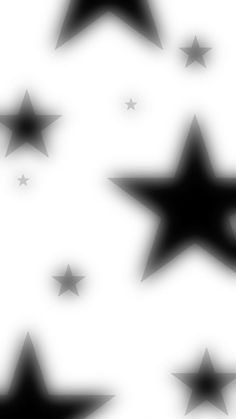 black and white stars are flying in the air