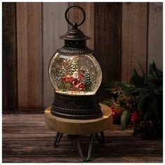 an old fashioned snow globe with christmas decorations