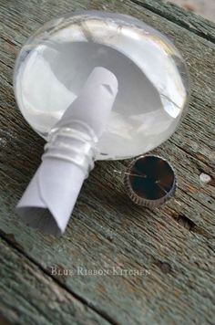 a close up of a paper mache on a wooden table with a hole in it