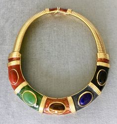 You are looking at a truly exquisite VINTAGE ALEXIS KIRK BOLD STONE CABOCHON and ENAMEL ART DECO MODERNIST ABSTRACT INSPIRED GOLD-TONE METAL STATEMENT OMEGA CHAIN CHOKER COLLAR NECKLACE, SIGNED, Circa 1970's.THIS NECKLACE IS A TRUE WORK OF ART!!!!A STUNNING AND UNIQUE PIECE, WITH THE ALEXIS KIRK AESTHETIC AT ITS BEST!!!!IN OUTSTANDINGLY FLAWLESS CONDITION!!!TWO DIFFERENT SETS OF MATCHING EARRINGS AVAILABLE FOR SALE ON DIFFERENT LISTINGS, SHOWN IN PICTURES #4 and #9.This collar choker necklace is Elegant Multicolor Cabochon Necklaces, Multicolor Metal Necklaces For Collectors, Multicolor Costume Jewelry Necklace For Collectors, Snake Chain Gold, Metal Collar, Enamel Art, Designer Runway, Choker Collar Necklace, Hand Painted Jewelry