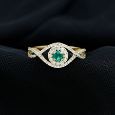 Product Details Experience the enchanting allure of this Crossover Ring adorned with a Round Shape Lab Created Emerald and sparkling Diamond stones. This stunning Created Emerald Ring is the perfect choice for a heartfelt proposal to your beloved. Let the vibrant green hue of the lab-created emerald and the brilliance of the Diamond stones symbolize your love and devotion, making this ring a cherished and meaningful token of your affection. Product Information SKU SHP-RINGS0821195109 Width 4.8 mm Height 9.5 mm Weight 2.39 gm (Approximate) LAB CREATED EMERALD INFORMATION No.of Stones 1 Pieces Total Weight 0.27 Carat (Approximate) Dimension(approx) Round-4X4 mm-1 Pcs Color Green Cut Brilliant Shape Round Setting Type Prong-Setting Quality Grade AAAA DIAMOND INFORMATION No.of Stones 72 Pieces Diamond Crossover Ring, Crossover Diamond Ring, Crossover Ring, Lab Created Emerald, Sparkling Diamond, Signature Jewelry, Timeless Jewelry, Vibrant Green, Emerald Ring