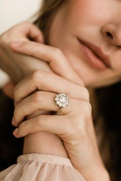 a close up of a person wearing a ring